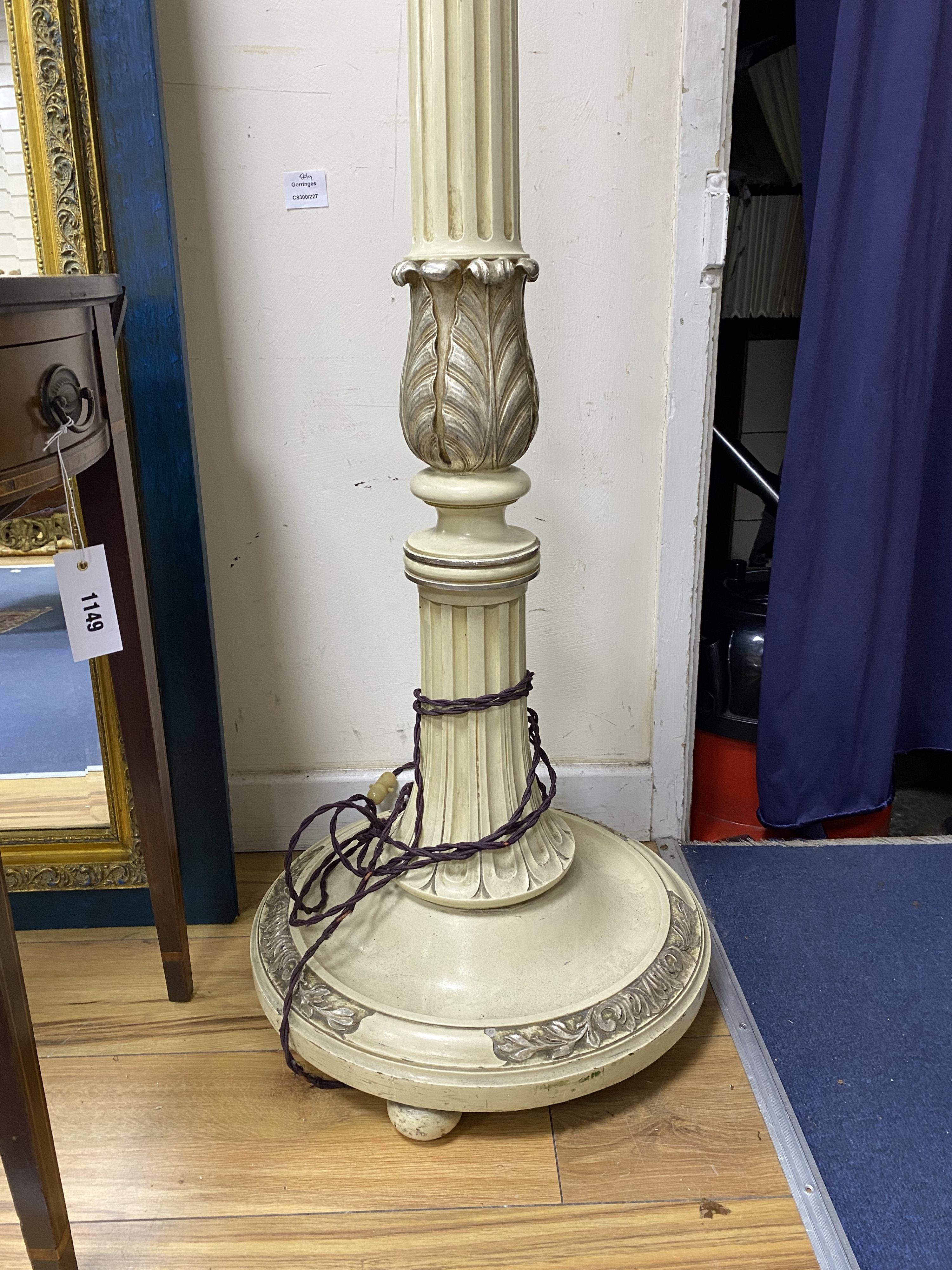 A cream painted part silvered uplighter floor lamp, height 190cm